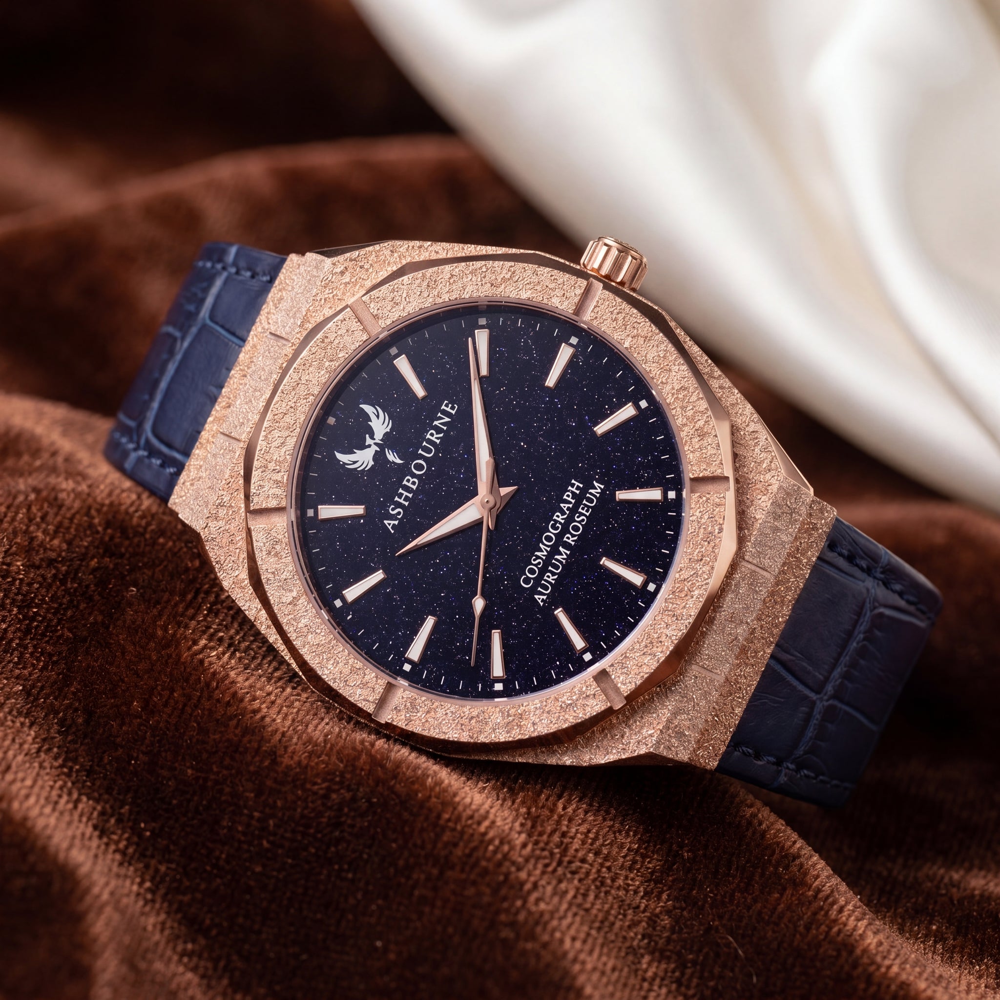 Ashbourne Corium Aurum Roseum prachtig chique rosegouden herenhorloge met royal blauwe lederen band.